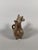 Zoomorphic vase in the form of two-headed deer. Terracotta with a red slip painted with floral motifs. The rounded handle...