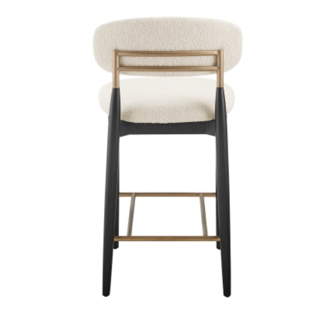 This stylish Counter Stool brings refined elegance and modern appeal to your dining or kitchen space with its chic mix of...