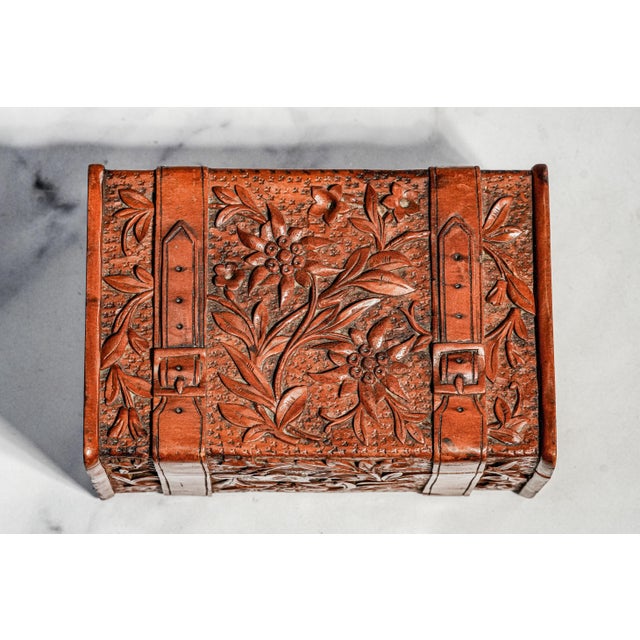 A charming example of Victorian craftsmanship, this antique carved wooden box embodies the romantic elegance and...