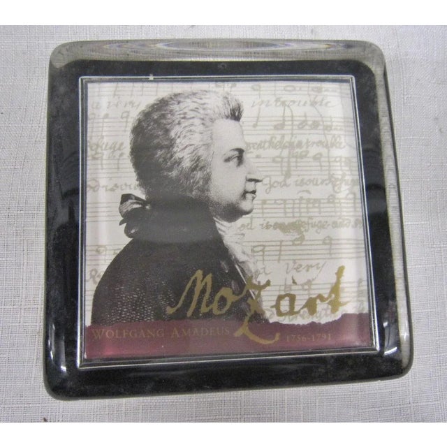 Heavy cast glass paper weight depicting a profile of Mozart. 70's Era in it's original presentation box. It measures 4"x...