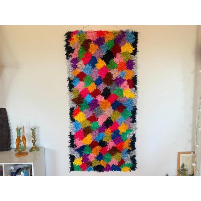Woven textile by Danish textile artist, Inger Holst Sørensen. Rya rug, wool, that evokes the shape of an era, signified by...