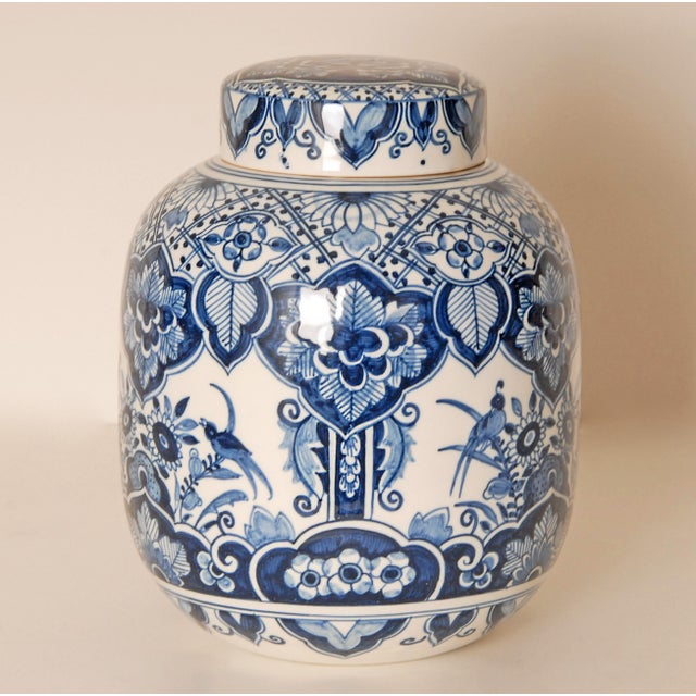 Large Delft vase - covered Jar Chinoiserie in the Chinese Kangxi Style Decorated with Ruyi, birds, flowers and leaves. The...