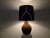 A striking vintage table lamp fully clad in rich chocolate-brown suede, featuring a sculptural gourd-shaped base and an...