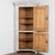 19th century Swedish Gustavian corner cabinet crafted in pine, standing stately just under 7' tall. This cabinet features...