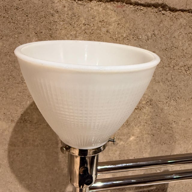 For your consideration, a mid-century modern designed by Nessen chrome desk or table lamp with swing arm. Glass shade...