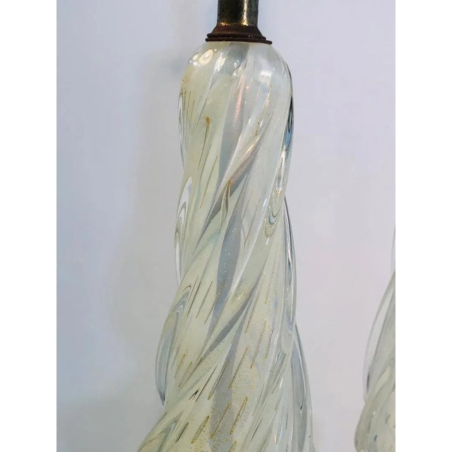 Pair of murano lamps with gold flaked Seguso handblown glass, 1960’s. Measures 33” overall height, 6” diameter. In good...