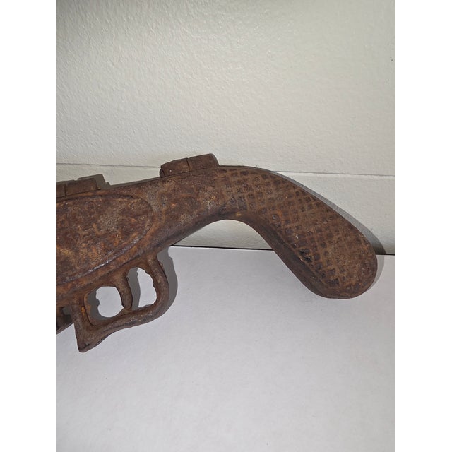 Super cool rustic ranch cowboy decor cast Iron faux gun that opens to become a boot jack.