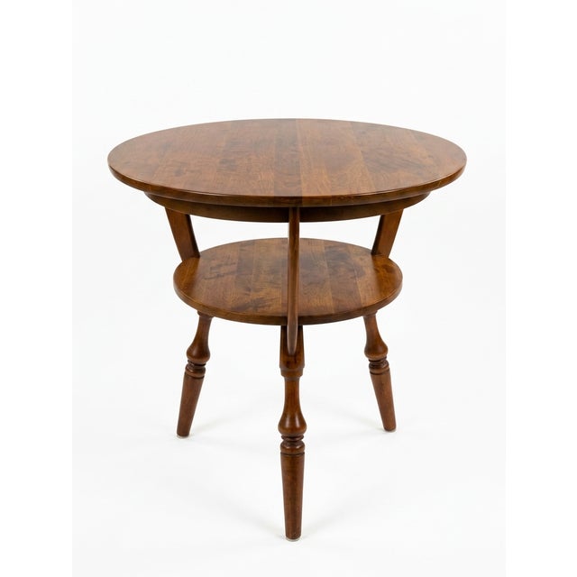 A Bucks Country tripod two tier Gueridon / Center table in solid cherry in good vintage condition. Original condition....