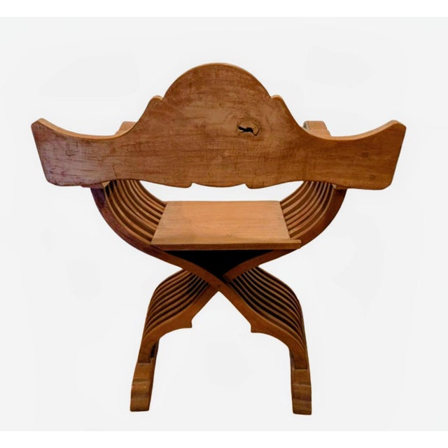This piece is in the style of an iconic 15th-century Italian Renaissance folding chair characterized by an "X" or...
