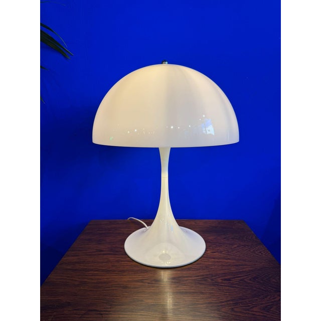 The Panthella lamp was designed in 1971 by Danish design icon Verner Panton and is one of his most popular designs. Its...