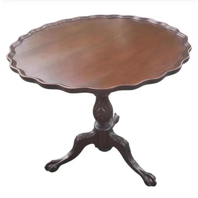 Exquisite antique tilt top pie crust pedestal mahogany tea table / center table in very good vintage condition from the...