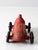 A vintage Auburn Rubber Co. USA 536 toy car. This Indy racer car has a red patinated body with black wheels.