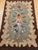This charming early American hand-hooked rug was crafted in the early 1900s in the New England tradition � one of the...