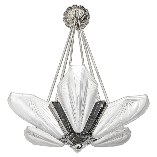 French Art Deco chandelier was created by the French Artist "E.J.G" in great condition. Six shades in clear frosted glass...
