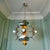 This chandelier has been restored to its original beauty. It is made of metal painted orange and equipped with four E14...