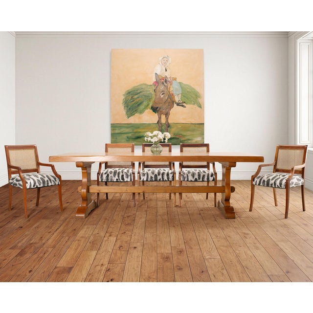 A striking set of eight cane and mahogany Danish dining armchairs crafted in a mid-century Scandinavian modern style. The...
