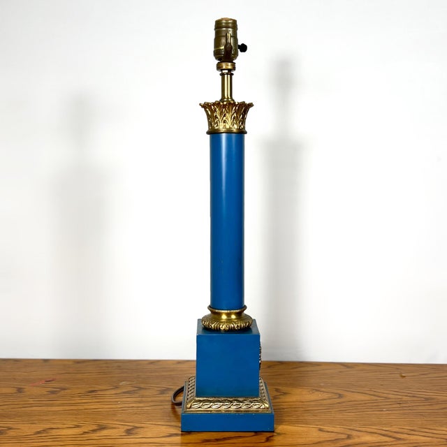 Mid-century neoclassical table lamp featuring a solid brass structure and a deep lapis lazuli blue plated finish. This...