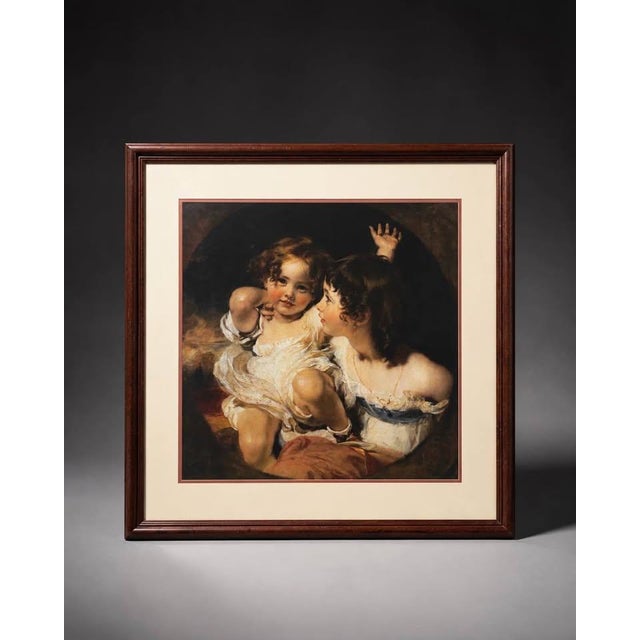 A classic portrait-style framed wall art piece with a warm traditional composition, cream matting, and a dark brown wood...