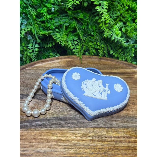 This is an elegant vintage Wedgwood Jasperware heart-shaped trinket box, finished in the classic matte "Wedgwood blue"...