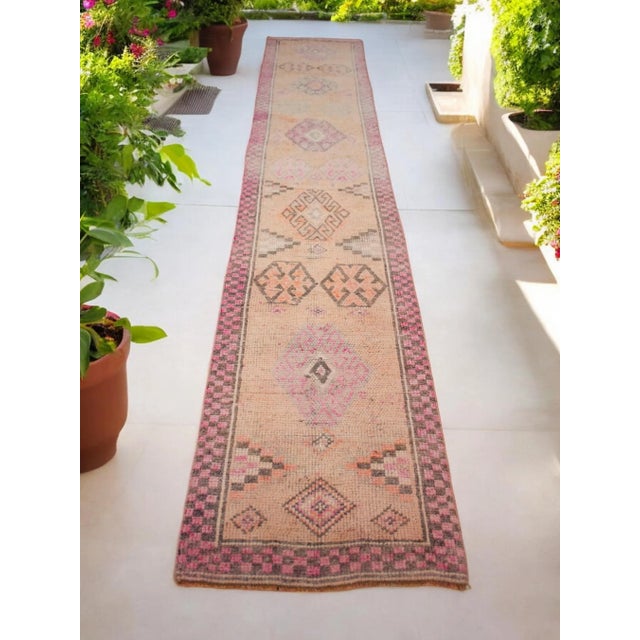 Add a touch of vintage charm to your hallway with this beautiful 3x14 Runner Rug! Handmade with care, this Oushak Rug...