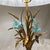 A refined pair of vintage table lamps crafted in patinated bronze and accented with decorative floral elements. Each lamp...