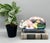 Gorgeous, ceramic sleeping cat by Andrea by Sadek, beautifully decorated in a vibrant tobacco leaf pattern with pink...
