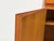 Exceptional danish highboard, consisting of two modules. teak-veneered body with solid teak doors and veneered panels....