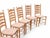 This charming set of four vintage French ladderback dining chairs reflects the timeless elegance of mid-century French...