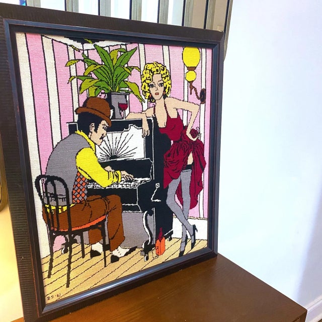 Man I just love a fun needlepoint! This Art Deco style wall art is a colorful saloon/bar scene with a young lady dressed...