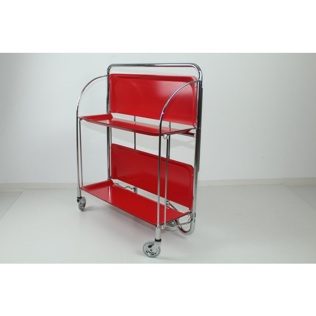 Bar trolley from Bremshey / Solingen, so-called dinette, foldable on 2 sides, red plastic plates, chrome frame. I have...