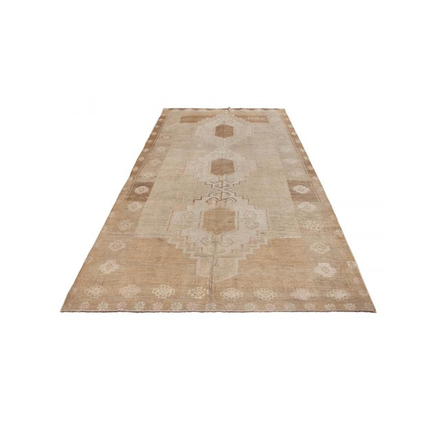 Handknotted vintage wool rug from Kars region of Turkey. Dated 1987. In very good condition.