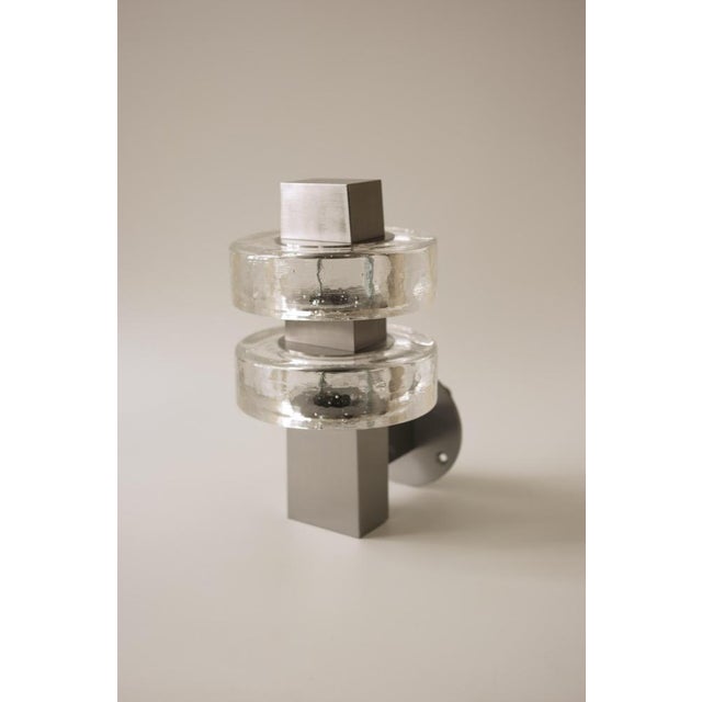 Gioiello i wall lamp in stainless steel and glass by studio marine breynaert. Dimensions: w 14 x d 17 x h 25 cm....