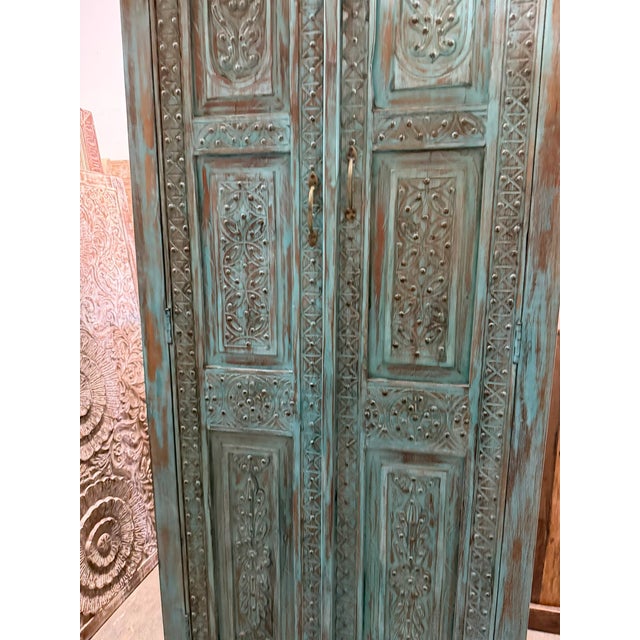 Mid-Century Modern Antique Blue Hand-Carved Armoire | Floral Carved Cabinet With Brass Stud Accents For Sale - Image 3 of 7