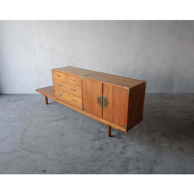This is a wonderful 3 piece mid century set. An 8.5 ft bench with 2 repositionable cabinets. The set is solid teak...