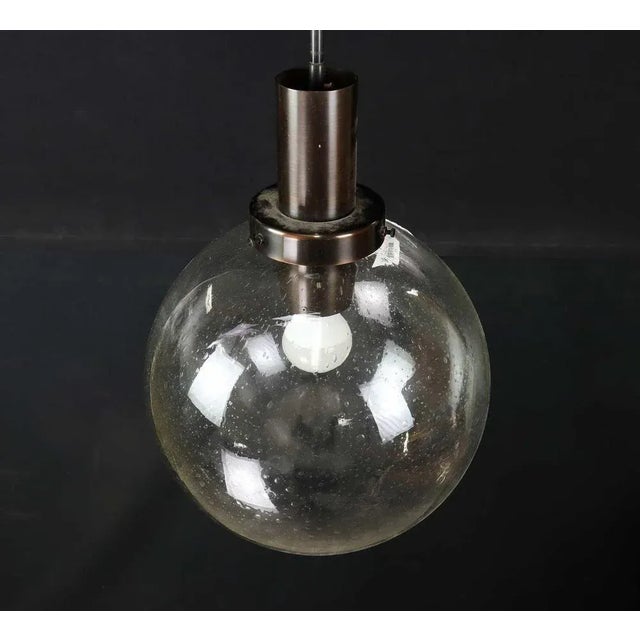 Exquisite pendant lamp crafted in Sweden by Hans-Agne Jakobsson, Markaryd, in the year 1960. These lamps showcase an...