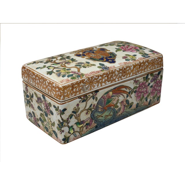 This exquisite export-style porcelain rectangular box and cover is exquisitely enameled in vibrant famille rose palette...