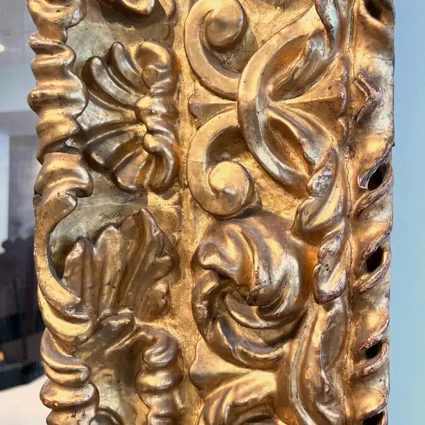 An exceptional and rare Spanish Louis XIV mirror featuring a boldly carved giltwood frame with dramatic scrollwork,...