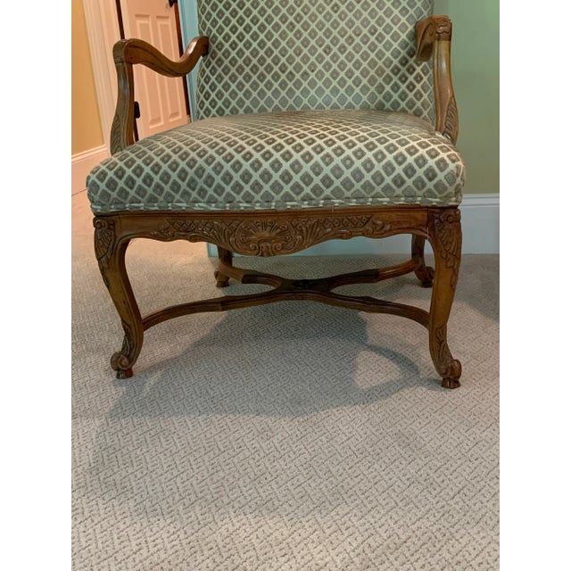 Pleasing patterned upholstery on a stylish Pecan wood framed arm charm. Extremely comfortable. Perfect for morning coffee...