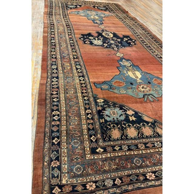 "This is a spectacular and exceptionally rare monumental antique Bijar rug, dating back to circa 1860. Measuring an...
