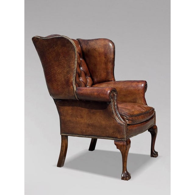 Quality Untouched Brown Leather Victorian Wing Armchair This high quality late 19th-century brown leather button back wing...