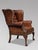 Quality Untouched Brown Leather Victorian Wing Armchair This high quality late 19th-century brown leather button back wing...