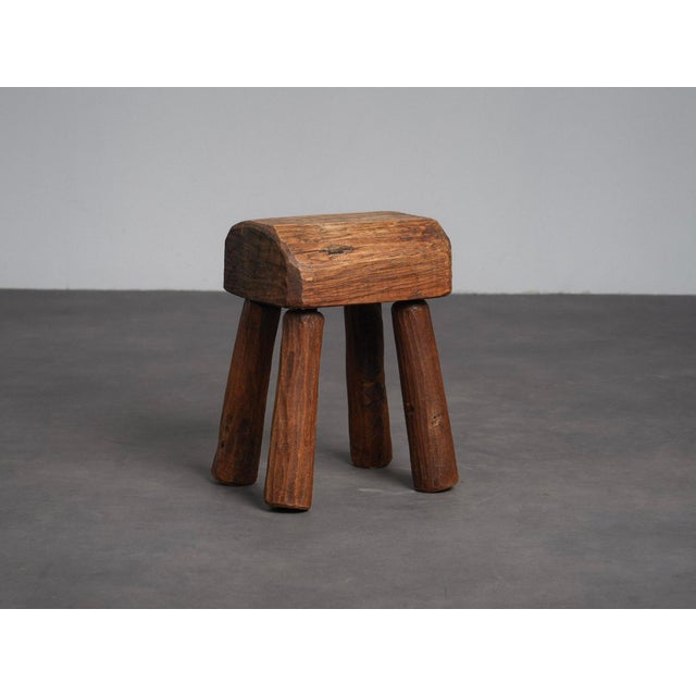 A beautifully primitive solid wood stool from europe, dating from the 1970s. Constructed from substantial pieces of solid...