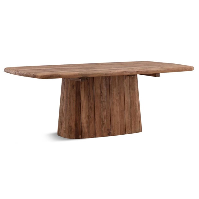 Crafted from solid salvaged teak, this sculptural dining table showcases thick plank construction, softly rounded edges...