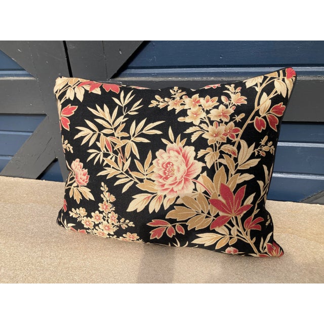 A pillow made from a 19th century floral printed cotton, backed with vintage cotton ticking stripe a down insert is included.