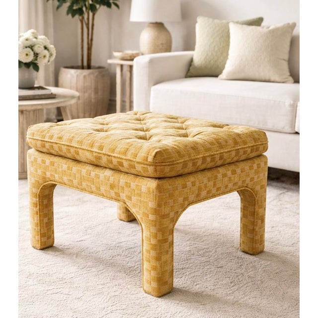 Vintage tufted ottoman upholstered in a rich golden yellow velvet with a subtle basketweave texture. The generously padded...