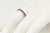 Channel Set Ruby 18K White Gold Eternity Band Ring A classic eternity-style band crafted in 18K white gold, set with a...