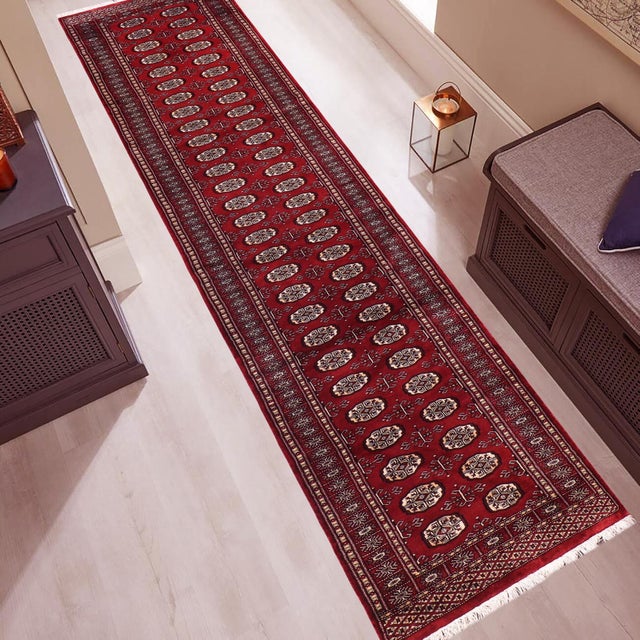 Transform the interior of your home with a beautiful hand-knotted Bokhara rug. Meticulously crafted with intricate...