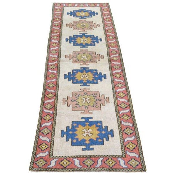 Vintage Turkish Anatolian hand knotted wool rug with natural colors.