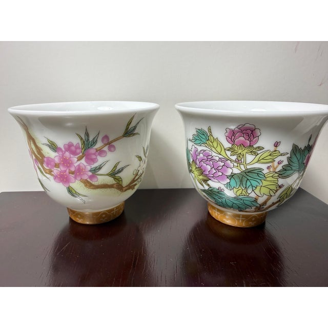 The Pair Kangxi Signed Chinese Famille Rose Flower Wine/tea Cups with Poem are exquisitely hand-painted. Featuring...