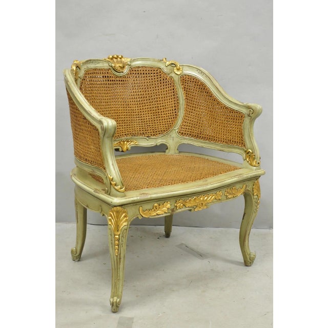 Vintage Reproduction French Louis XV Style Green Distressed Painted Gold Gilt Cane Bergere Lounge Arm Chair. Item features...
